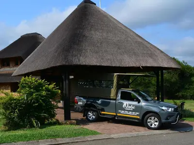 a pick up truck parked under a thatch roof at Kruger Park Lodges - Pangane M Properties Unit 538, 571A, 571B in Hazyview