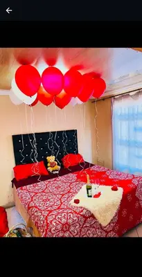 a bedroom with balloons hanging above a bed at Musanda Lifestyle Centre in Makonde