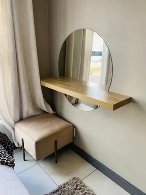 a mirror and a chair in a room at Kayalako at theBlyde 1 in Pretoria