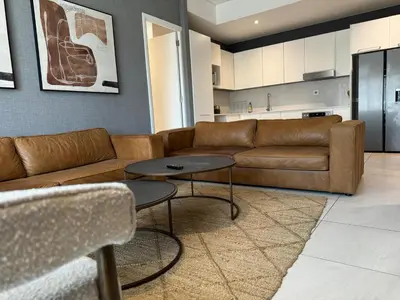 a living room with a couch and a table at Modern holiday home in Pretoria