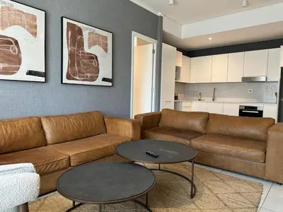 a living room with a couch and a table at Modern holiday home in Pretoria