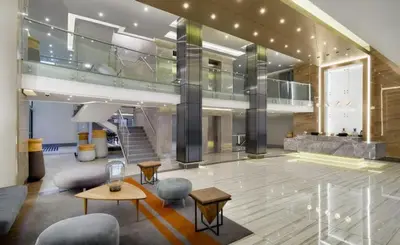 a large lobby with chairs and tables in a building at 514 at The Regency in Pretoria