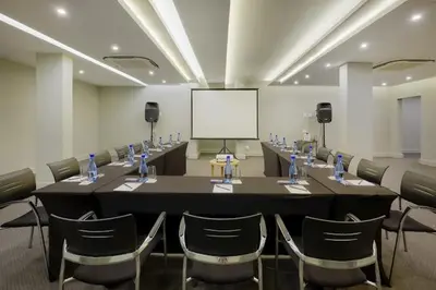 a conference room with a long table and chairs at 514 at The Regency in Pretoria