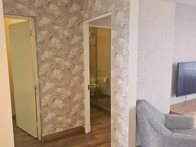 a room with a bathroom with a wall at 514 at The Regency in Pretoria