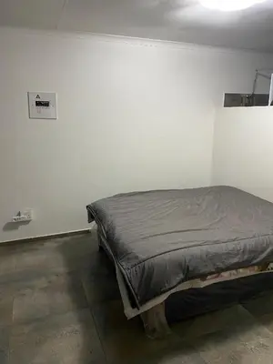 a bedroom with a bed in a room at AM'S place in Kempton Park