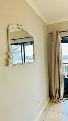 a mirror in a room with a window at Bookings At The Blyde Crystal Lagoon in Pretoria