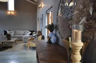 a living room with a couch and a table at 22 on Ridgeway in Dullstroom