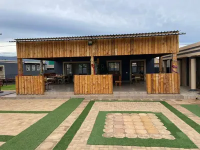 a building with a pavilion in the middle of a courtyard at Dingwako Lodge in Mokopane