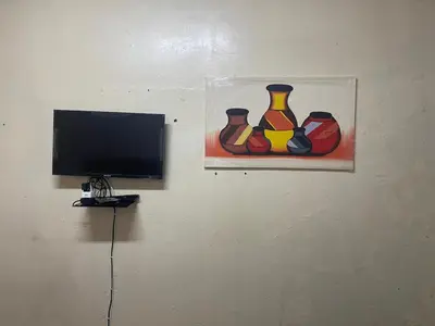 a painting of three colorful vases on a wall at Cardinal Guest House in Pretoria
