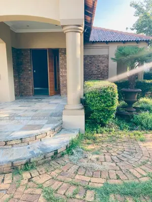a house with a front porch with a pillar at BudiasGuest B&B in Kempton Park