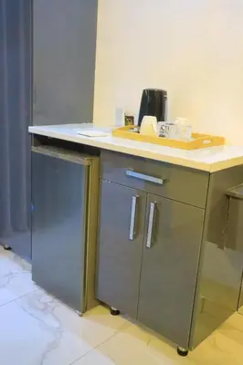 a kitchen with a counter top and a refrigerator at Musina Crown Guest House in Musina
