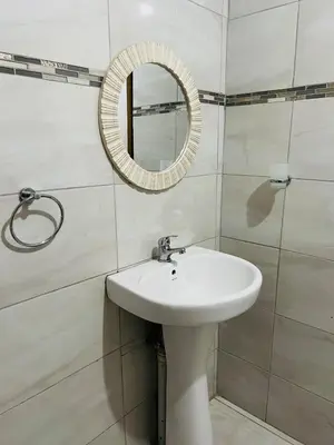 a bathroom with a sink and a mirror at The Ripanga Nest in Nelspruit