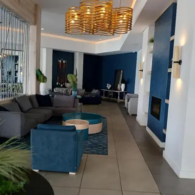 a living room with a couch and a table at The Blyde 1-Bed Luxe Apartment in Pretoria