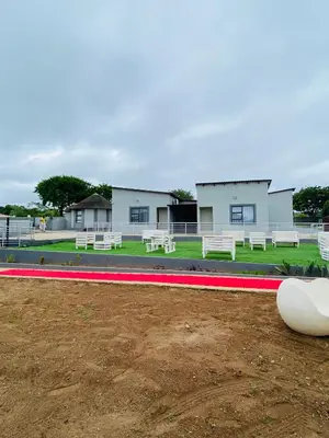 a row of benches in front of a building at Shibar farm house Mpumalanga in eLundi