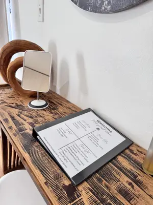 a table with a laptop on top of a table at Cozy Suburban Escape in Benoni