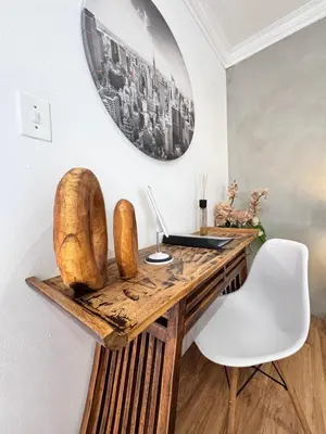 a desk with a laptop and a white chair at Cozy Suburban Escape in Benoni