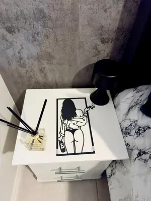 a white table with a picture of a woman on it at Dimension 1 in Midrand