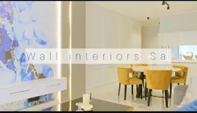 a dining room with a table and yellow chairs at 2 bedroom luxury Ellipse waterfall in Midrand
