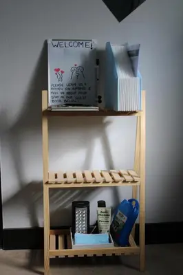 a small wooden shelf with items on it at Cypress Nest Retreat in Midrand