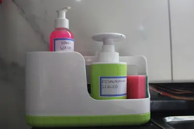 a toothbrush holder with two bottles of toothpaste at Cypress Nest Retreat in Midrand