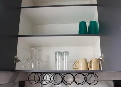 a shelf in a kitchen with glasses on it at Cypress Nest Retreat in Midrand