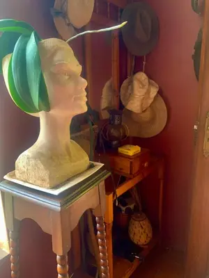 a bust of a woman sitting on a table at Hermit Hill in Broederstroom