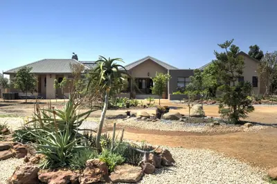 a garden in front of a building at The Finches Nest in Hammanskraal