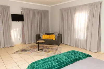 a living room with a couch and a table at 22 Eland in Polokwane