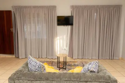 a living room with a couch and a table at 22 Eland in Polokwane