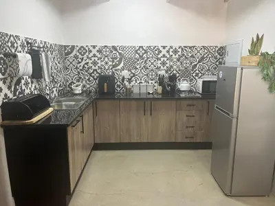 a kitchen with a refrigerator and a sink at @144 Rabe in Mokopane