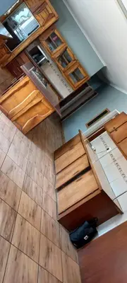 an overhead view of an empty room with wooden cabinets at Majestic Guest House in Mokopane