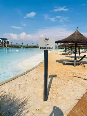 a sign on a beach with a palm beach at 1 bedroom- The Blyde by Given in Pretoria