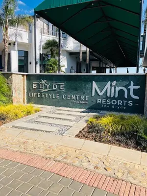a sign for a nursing center in front of a building at 1 bedroom- The Blyde by Given in Pretoria