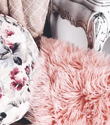 a pink furry rug sitting next to a chair at casa bella in Hartbeespoort