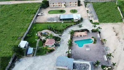 an aerial view of a house on a beach with a pool at Phendulani Lodge & Park in Calcutta