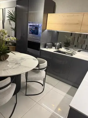 a kitchen with a table and a stove top oven at Cassini Dreaming in Northdene