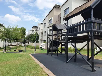 a playground with a slide and a swing set at Studio Apartment near Dainfern Golf Club I Montecasino I Indaba Hotel in Sandton