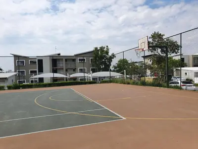 a basketball court in front of a building at Studio Apartment near Dainfern Golf Club I Montecasino I Indaba Hotel in Sandton
