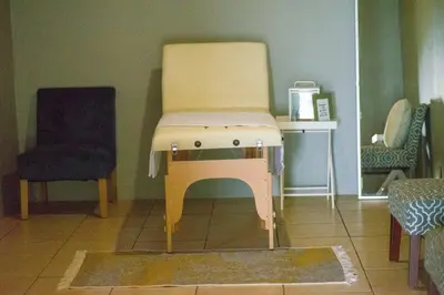 a chair sitting in the corner of a room at Kneizenberg Boutique Lodge & Spa in Louis Trichardt