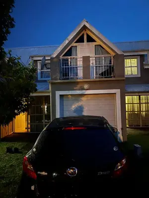 a black car parked in front of a house at 50 at Terrace in Nelspruit