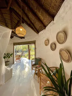 a living room with a table and chairs at Hot spring tiny home in Limpopo in Gemsbokfontein