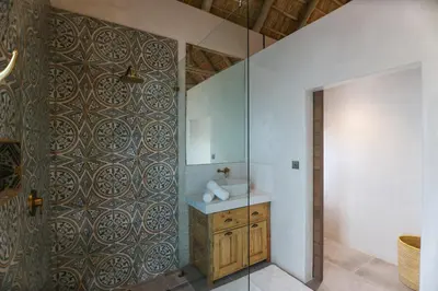 a bathroom with a sink and a mirror at Bush House Zandspruit in Hoedspruit