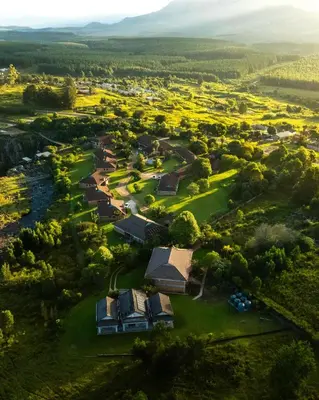 an aerial view of a village with houses and trees at Mogodi Lodge in Graskop