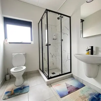 a bathroom with a shower and a toilet and a sink at UNIT 1487 The blyde crystal lagoon in Pretoria