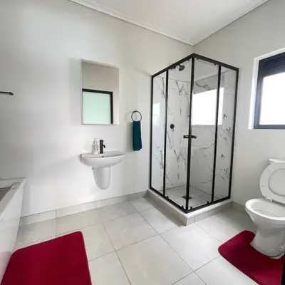 a bathroom with a shower and a toilet and a sink at UNIT 1487 The blyde crystal lagoon in Pretoria