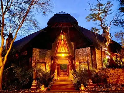 a house with a pathway leading to the front door at Fevertree Private Lodge in Warmbaths