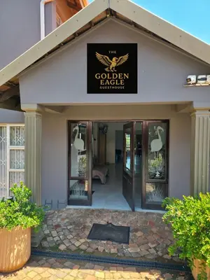 a building with a sign that reads the golden eagle sanctuary at The Golden Eagle Guest House in Kempton Park