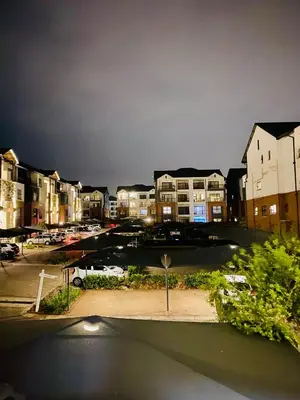 a view of a parking lot at night at Sushii luxury apartment The Blyde in Pretoria