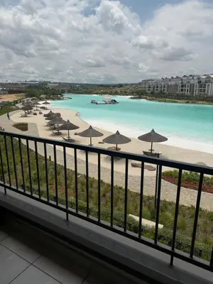 a view of a beach with umbrellas and the water at Treger views in Midrand
