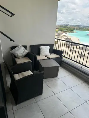 a balcony with chairs and a view of the ocean at Treger views in Midrand